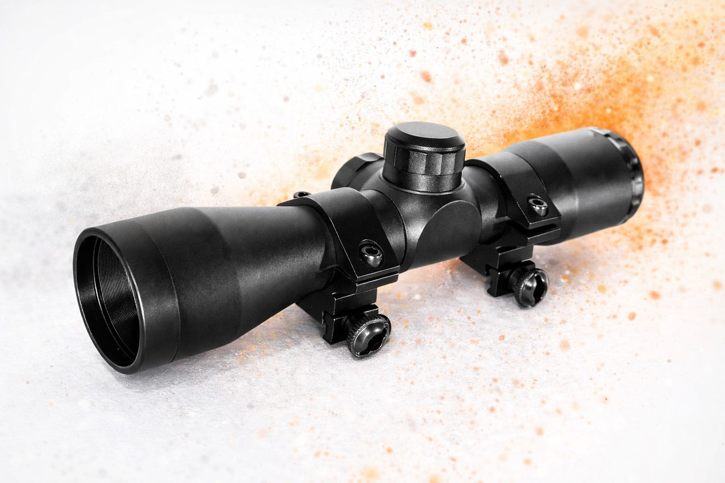 Black rifle scope on a textured white surface