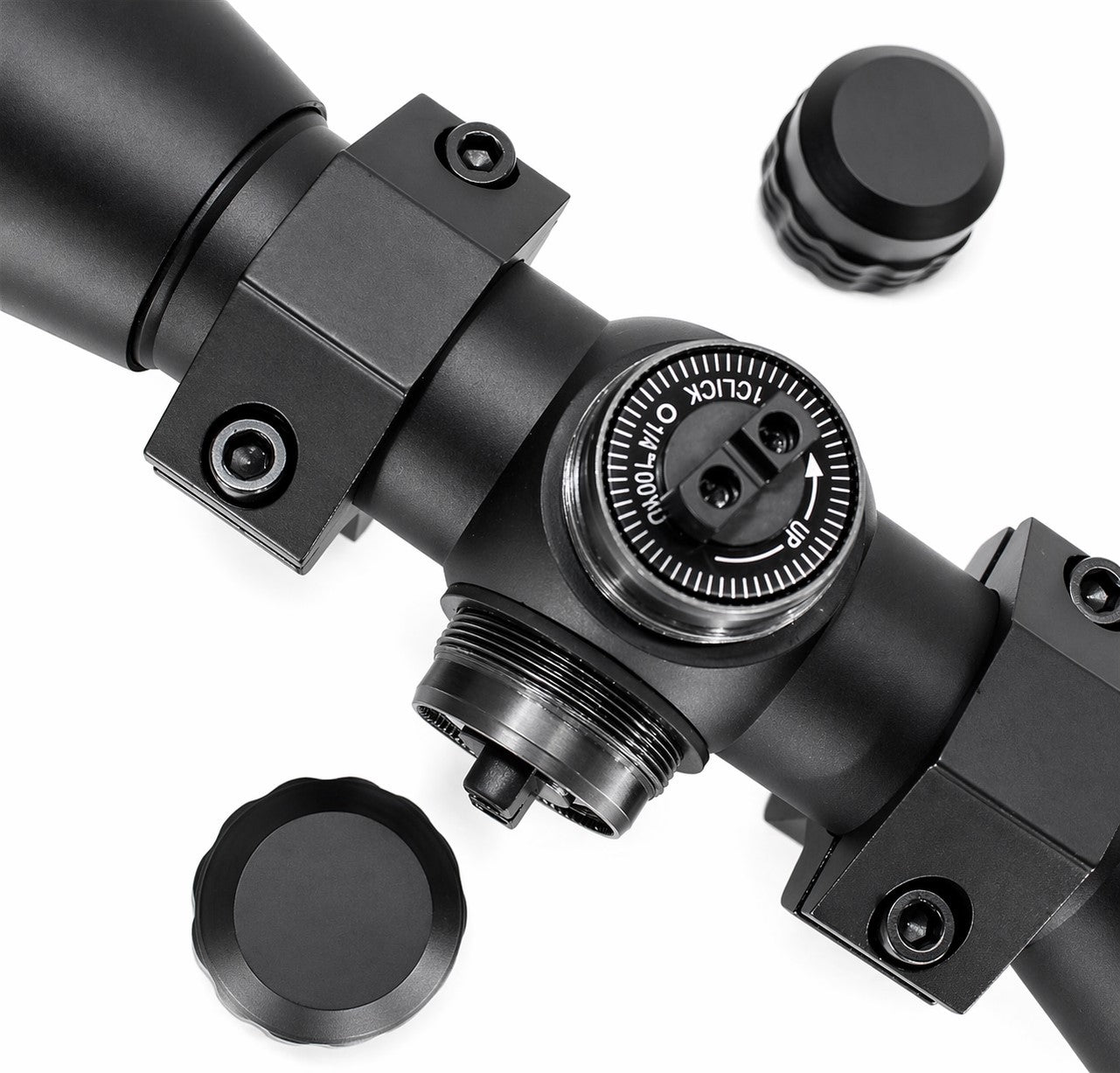 Close-up of a black rifle scope on a white background